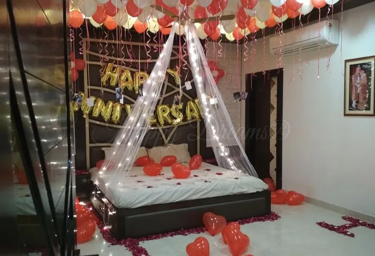 Anniversary decoration with roses, candles and fairy lights by Memoré Events Mumbai